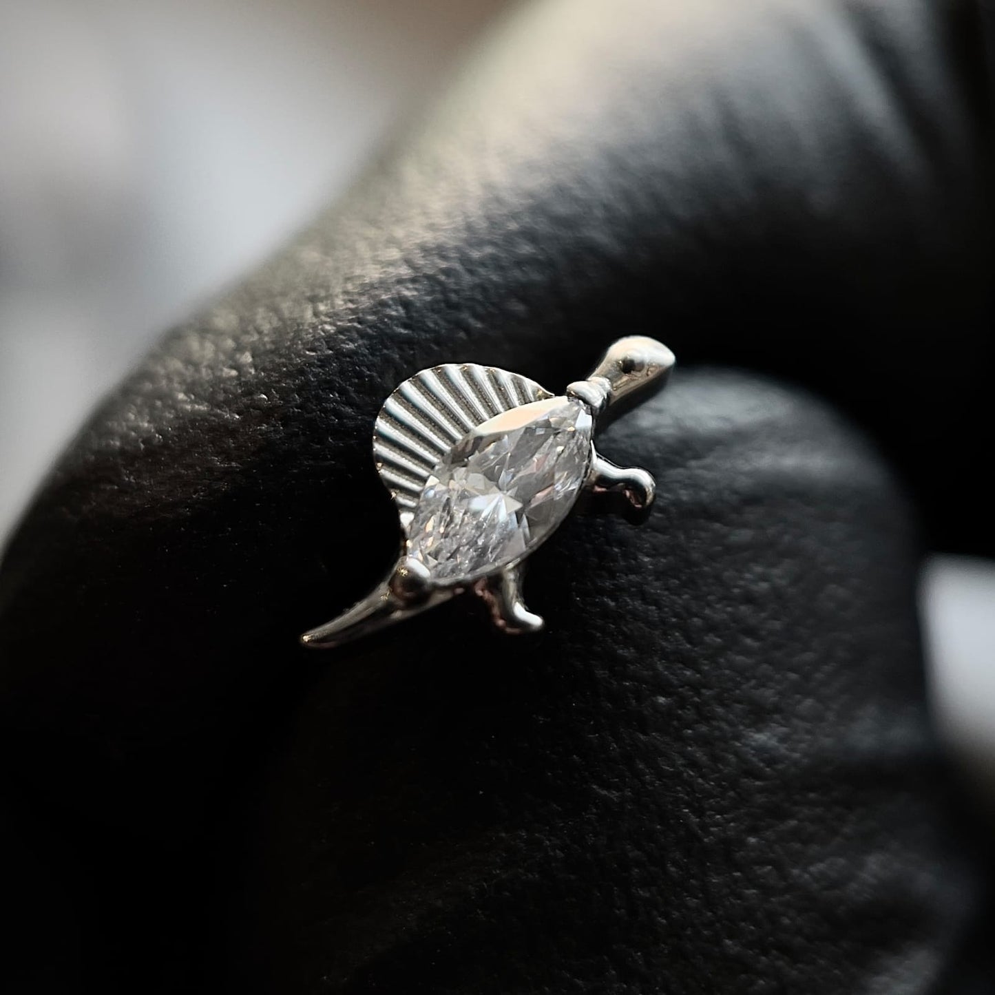 dinosaur stud with zirconia